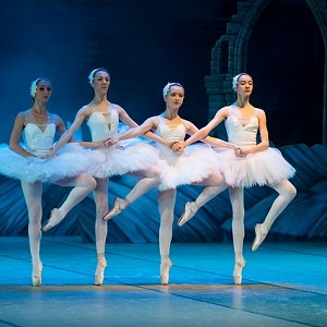 A group of ballerina performing in the stadium.