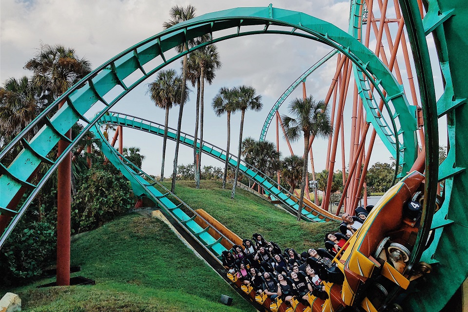 an image showing people enjoying themselves on a gaint roller coaster.