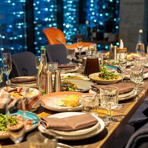 Dining table decorated with food and drinks at Aquater.